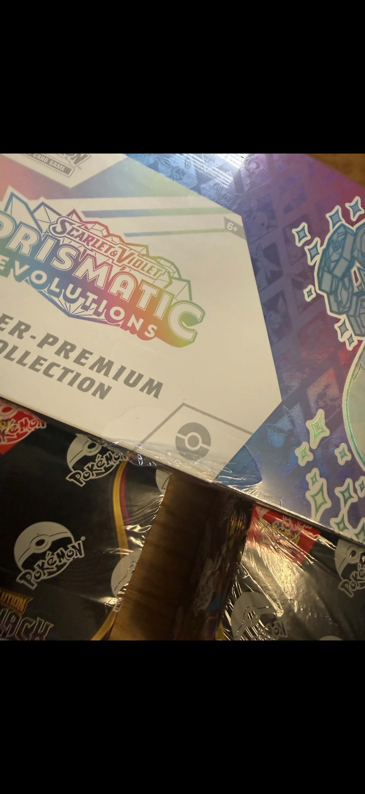 Prismatic Evolutions Super-Premium Collection (Small rip on front see photo)
